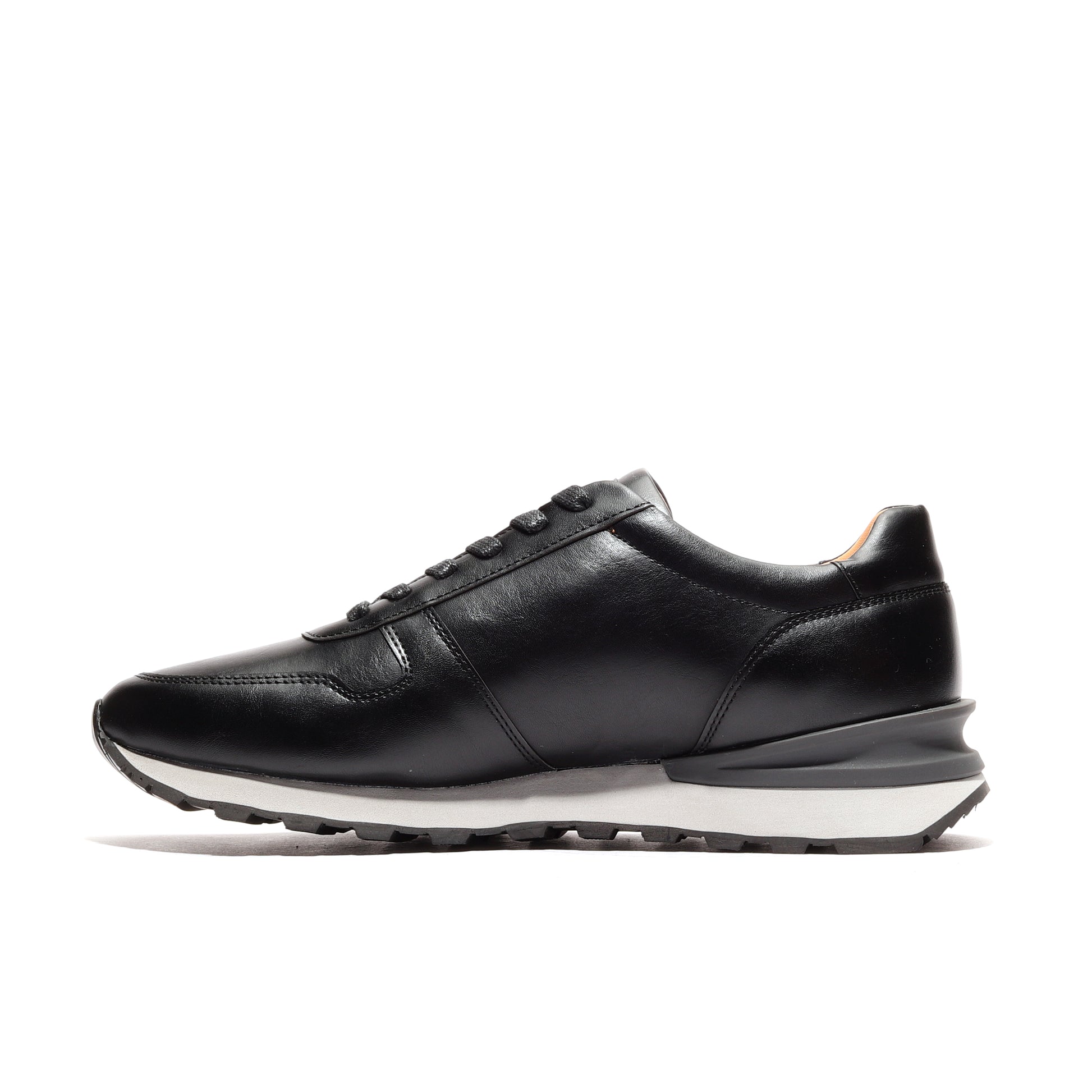 Inner side view of black athleisure shoes for men, designed as luxe runners, showcasing the shoe's craftsmanship and comfortable fit, ideal for performance and casual wear.