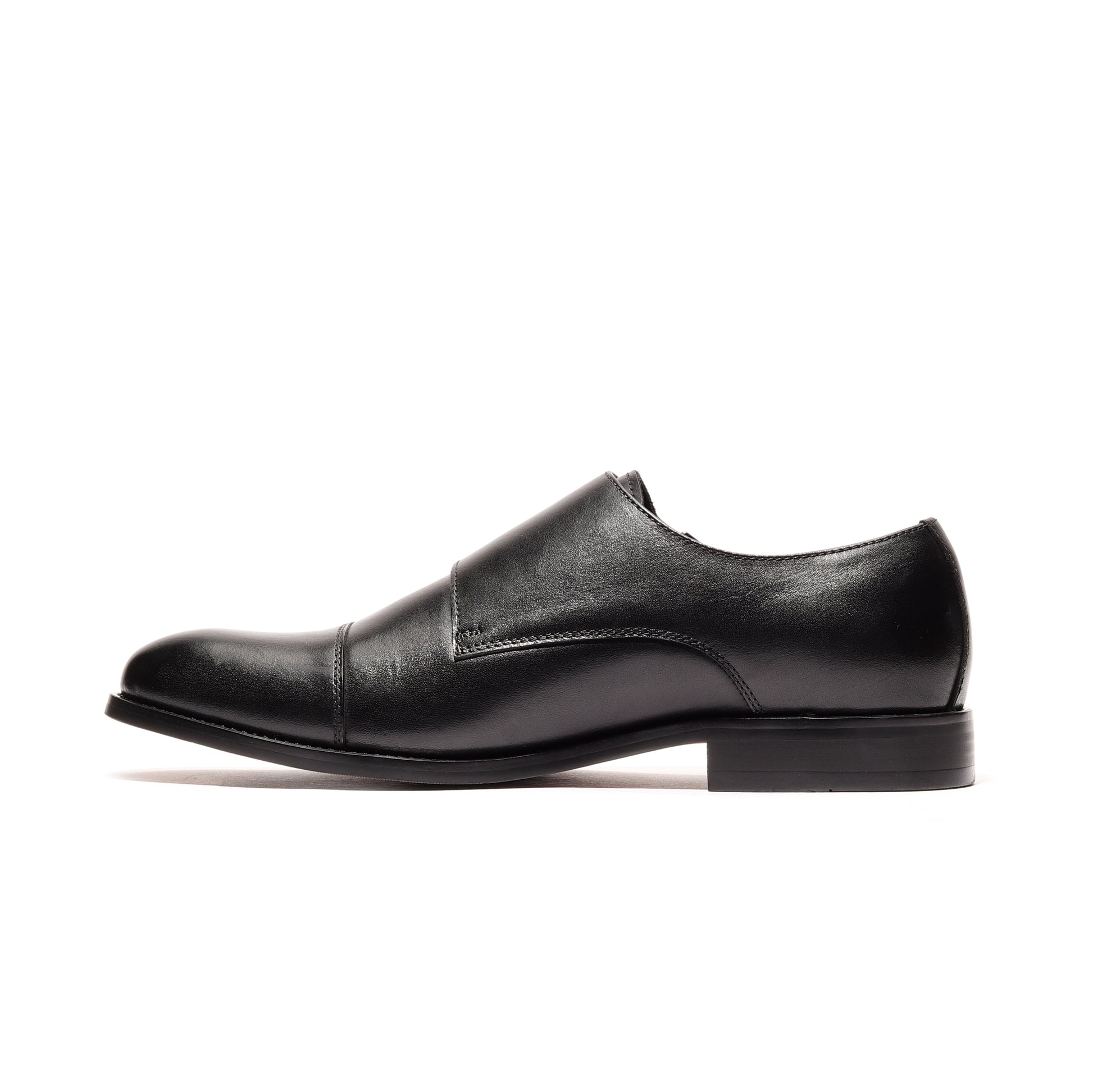 Inner side profile of black genuine leather shoes, showcasing the craftsmanship and design details for a sophisticated look.