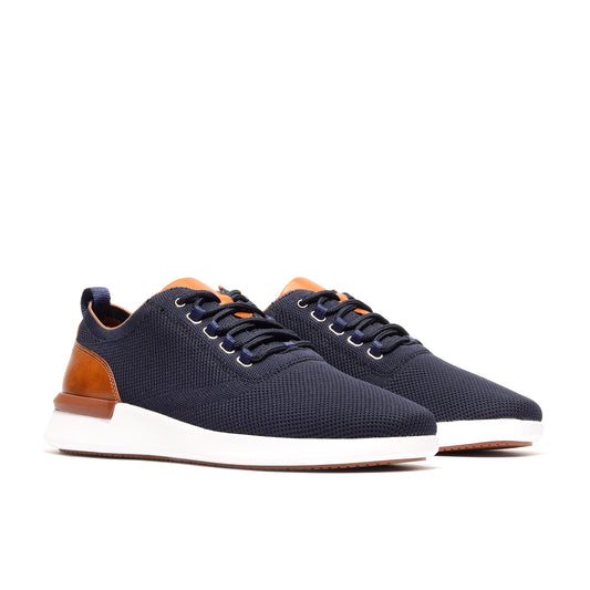 Angled view of navy men’s athleisure shoes, highlighting their modern design and comfortable construction